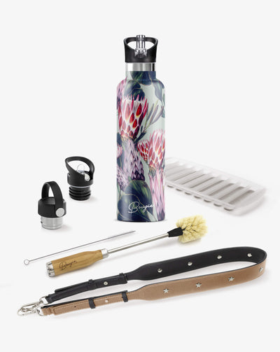 collection gift box with purple, red protea flowers with green leaf design water bottle, 2 lids, bottle brush cleaner, tan strap bottler carrier and ice stick tray